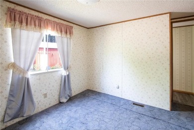 Well-kept and updated 3 bed/2 bath manufactured home on nearly on Moose Lake Golf Club in Minnesota - for sale on GolfHomes.com, golf home, golf lot