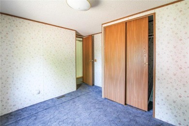 Well-kept and updated 3 bed/2 bath manufactured home on nearly on Moose Lake Golf Club in Minnesota - for sale on GolfHomes.com, golf home, golf lot