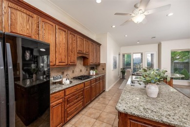 Let the golf cart paths welcome you to this refined single-story on Stonebridge Ranch Country Club in Texas - for sale on GolfHomes.com, golf home, golf lot
