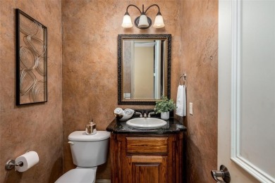 Let the golf cart paths welcome you to this refined single-story on Stonebridge Ranch Country Club in Texas - for sale on GolfHomes.com, golf home, golf lot