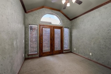 Let the golf cart paths welcome you to this refined single-story on Stonebridge Ranch Country Club in Texas - for sale on GolfHomes.com, golf home, golf lot
