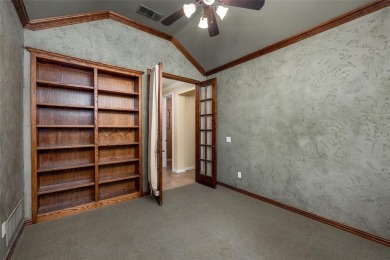 Let the golf cart paths welcome you to this refined single-story on Stonebridge Ranch Country Club in Texas - for sale on GolfHomes.com, golf home, golf lot