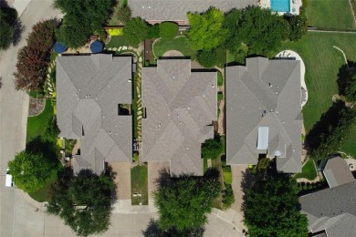 Let the golf cart paths welcome you to this refined single-story on Stonebridge Ranch Country Club in Texas - for sale on GolfHomes.com, golf home, golf lot