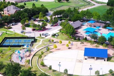 Let the golf cart paths welcome you to this refined single-story on Stonebridge Ranch Country Club in Texas - for sale on GolfHomes.com, golf home, golf lot