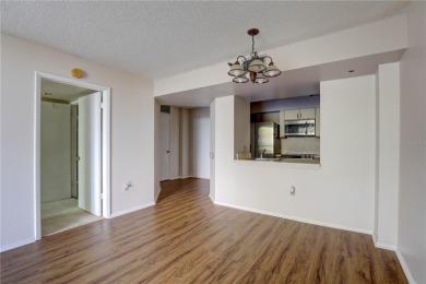Perched on the top floor of Crystal Bay, this fourth-story condo on Feather Sound Country Club in Florida - for sale on GolfHomes.com, golf home, golf lot