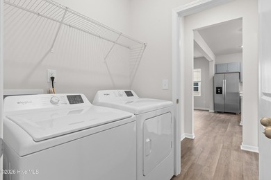 The Givens offers a beautifully crafted two-story design that on Harbour Point Golf Club in North Carolina - for sale on GolfHomes.com, golf home, golf lot