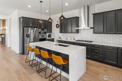 Situated on a premium corner lot with open views, in the heart on Raindance National Golf Course in Colorado - for sale on GolfHomes.com, golf home, golf lot