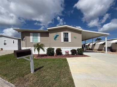 Were you searching for a WATERFRONT HOME with an 8,000 lb BOAT on Apollo Beach Golf and Sea Club in Florida - for sale on GolfHomes.com, golf home, golf lot