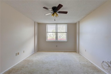 Perched on the top floor of Crystal Bay, this fourth-story condo on Feather Sound Country Club in Florida - for sale on GolfHomes.com, golf home, golf lot