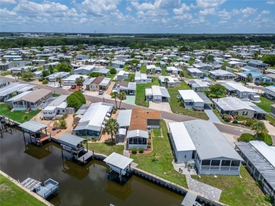 Were you searching for a WATERFRONT HOME with an 8,000 lb BOAT on Apollo Beach Golf and Sea Club in Florida - for sale on GolfHomes.com, golf home, golf lot