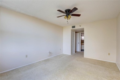 Perched on the top floor of Crystal Bay, this fourth-story condo on Feather Sound Country Club in Florida - for sale on GolfHomes.com, golf home, golf lot