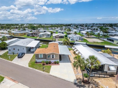 Were you searching for a WATERFRONT HOME with an 8,000 lb BOAT on Apollo Beach Golf and Sea Club in Florida - for sale on GolfHomes.com, golf home, golf lot