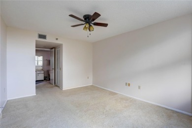Perched on the top floor of Crystal Bay, this fourth-story condo on Feather Sound Country Club in Florida - for sale on GolfHomes.com, golf home, golf lot
