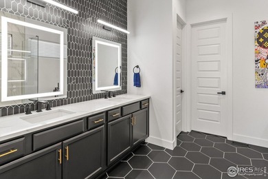 Situated on a premium corner lot with open views, in the heart on Raindance National Golf Course in Colorado - for sale on GolfHomes.com, golf home, golf lot