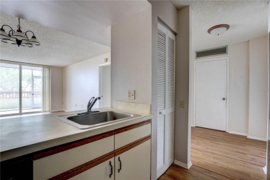 Perched on the top floor of Crystal Bay, this fourth-story condo on Feather Sound Country Club in Florida - for sale on GolfHomes.com, golf home, golf lot