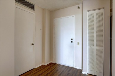 Perched on the top floor of Crystal Bay, this fourth-story condo on Feather Sound Country Club in Florida - for sale on GolfHomes.com, golf home, golf lot