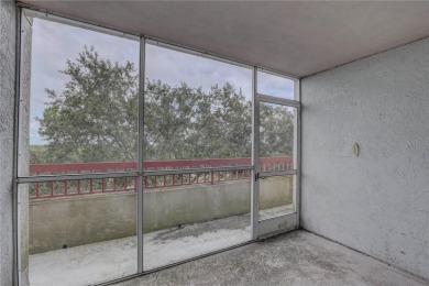 Perched on the top floor of Crystal Bay, this fourth-story condo on Feather Sound Country Club in Florida - for sale on GolfHomes.com, golf home, golf lot