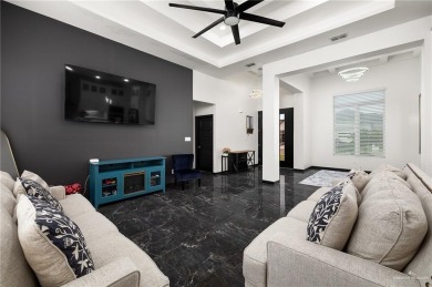 Experience the pinnacle of upscale living in this exquisite on Los Lagos Golf Club in Texas - for sale on GolfHomes.com, golf home, golf lot