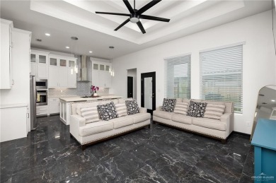 Experience the pinnacle of upscale living in this exquisite on Los Lagos Golf Club in Texas - for sale on GolfHomes.com, golf home, golf lot