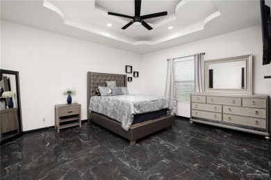 Experience the pinnacle of upscale living in this exquisite on Los Lagos Golf Club in Texas - for sale on GolfHomes.com, golf home, golf lot