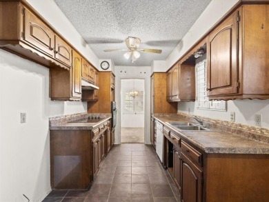 This three-bedroom, two-bathroom home is brimming with potential on Hillsboro Country Club in Texas - for sale on GolfHomes.com, golf home, golf lot