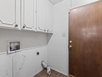 This three-bedroom, two-bathroom home is brimming with potential on Hillsboro Country Club in Texas - for sale on GolfHomes.com, golf home, golf lot