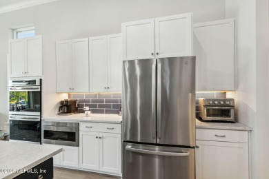PRICED TO SELL! Nestled on a corner lot, welcome to luxury on Amelia National Golf and Country Club in Florida - for sale on GolfHomes.com, golf home, golf lot