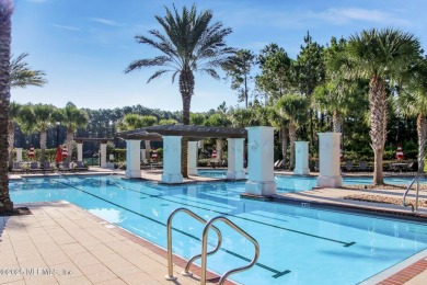 PRICED TO SELL! Nestled on a corner lot, welcome to luxury on Amelia National Golf and Country Club in Florida - for sale on GolfHomes.com, golf home, golf lot