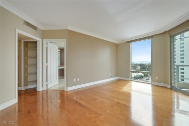 A stunning corner residence with floor-to-ceiling windows on Las Vegas Country Club in Nevada - for sale on GolfHomes.com, golf home, golf lot