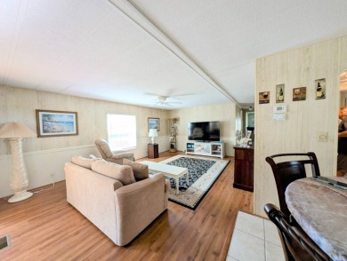 WELCOME TO YOUR NEW FLORIDA HOME WITH CARE-FREE LIVING!  This on Grasslands Golf and Country Club in Florida - for sale on GolfHomes.com, golf home, golf lot