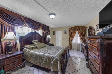 Priced to sell! Large Corner Unit! 2 bedroom/ 2 bathrooms, Lake on Flamingo Lakes Country Club in Florida - for sale on GolfHomes.com, golf home, golf lot
