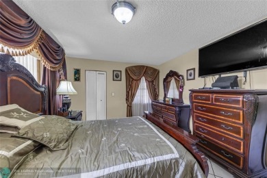 Priced to sell! Large Corner Unit! 2 bedroom/ 2 bathrooms, Lake on Flamingo Lakes Country Club in Florida - for sale on GolfHomes.com, golf home, golf lot