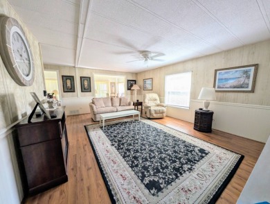 WELCOME TO YOUR NEW FLORIDA HOME WITH CARE-FREE LIVING!  This on Grasslands Golf and Country Club in Florida - for sale on GolfHomes.com, golf home, golf lot