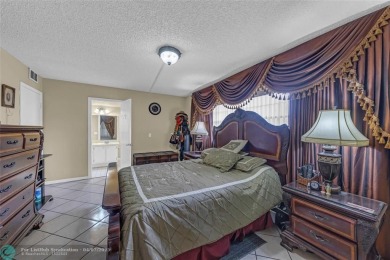 Priced to sell! Large Corner Unit! 2 bedroom/ 2 bathrooms, Lake on Flamingo Lakes Country Club in Florida - for sale on GolfHomes.com, golf home, golf lot