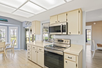 Step into this bright and inviting home featuring a formal on Timber Pines Golf Course in Florida - for sale on GolfHomes.com, golf home, golf lot