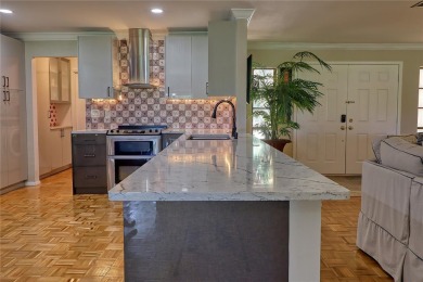 This home is a Head Turner, You are welcomed by the grand double on Palm Aire Country Club of Sarasota in Florida - for sale on GolfHomes.com, golf home, golf lot