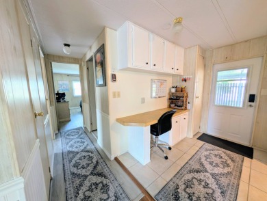 WELCOME TO YOUR NEW FLORIDA HOME WITH CARE-FREE LIVING!  This on Grasslands Golf and Country Club in Florida - for sale on GolfHomes.com, golf home, golf lot