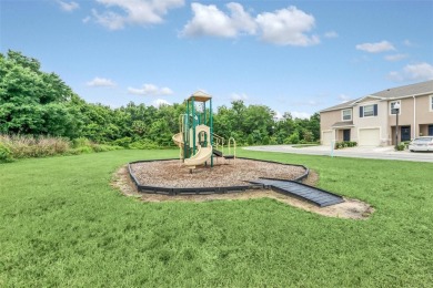 This Atria at Ridgewood Lakes contemporary two-story townhome is on Ridgewood Lakes Golf and Country Club in Florida - for sale on GolfHomes.com, golf home, golf lot
