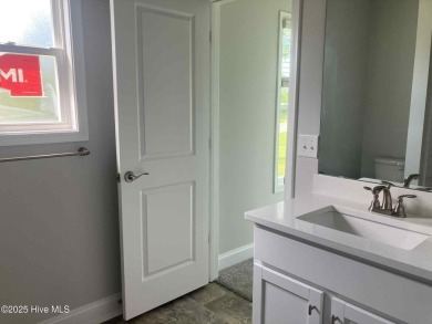 Welcome to your dream home at 1132 Coral Reef Drive in the on Harbour Point Golf Club in North Carolina - for sale on GolfHomes.com, golf home, golf lot