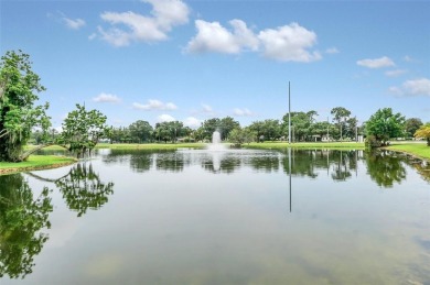 This Atria at Ridgewood Lakes contemporary two-story townhome is on Ridgewood Lakes Golf and Country Club in Florida - for sale on GolfHomes.com, golf home, golf lot