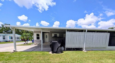 WELCOME TO YOUR NEW FLORIDA HOME WITH CARE-FREE LIVING!  This on Grasslands Golf and Country Club in Florida - for sale on GolfHomes.com, golf home, golf lot