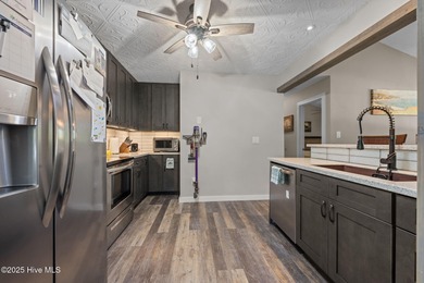 Welcome to 162 Quarterdeck Townes, a single-story townhome with on River Bend Golf and Country Club in North Carolina - for sale on GolfHomes.com, golf home, golf lot