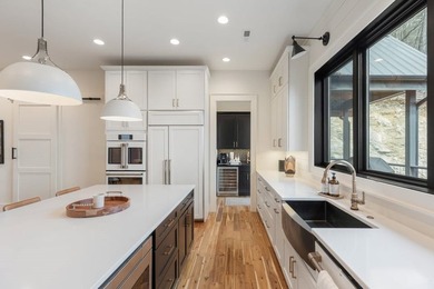 Completed in 2021, this beautifully crafted mountain home offers on Cullasaja Club in North Carolina - for sale on GolfHomes.com, golf home, golf lot