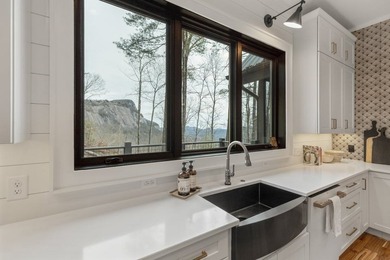 Completed in 2021, this beautifully crafted mountain home offers on Cullasaja Club in North Carolina - for sale on GolfHomes.com, golf home, golf lot