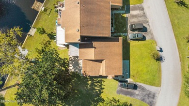 Welcome to 162 Quarterdeck Townes, a single-story townhome with on River Bend Golf and Country Club in North Carolina - for sale on GolfHomes.com, golf home, golf lot