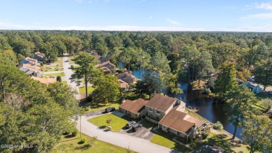 Welcome to 162 Quarterdeck Townes, a single-story townhome with on River Bend Golf and Country Club in North Carolina - for sale on GolfHomes.com, golf home, golf lot