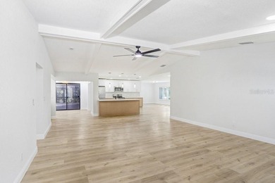 Nestled on a desirable corner lot in Feather Sound, this fully on Feather Sound Country Club in Florida - for sale on GolfHomes.com, golf home, golf lot