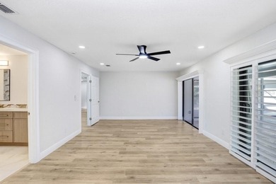 Nestled on a desirable corner lot in Feather Sound, this fully on Feather Sound Country Club in Florida - for sale on GolfHomes.com, golf home, golf lot