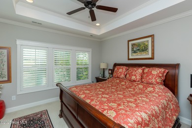 Situated along the fairways of the Woods Golf Course in on Whispering Woods in North Carolina - for sale on GolfHomes.com, golf home, golf lot