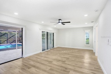 Nestled on a desirable corner lot in Feather Sound, this fully on Feather Sound Country Club in Florida - for sale on GolfHomes.com, golf home, golf lot